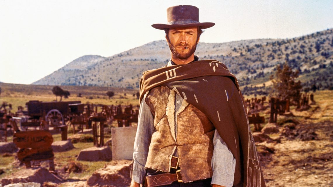 Clint Eastwood como o personagem 'Blondie' no cemitério do filme 'O Bom, o Mau e o Feio', representando um arquétipo de indivíduo solitário e seletivo.