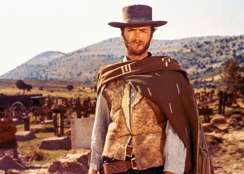 Clint Eastwood como o personagem 'Blondie' no cemitério do filme 'O Bom, o Mau e o Feio', representando um arquétipo de indivíduo solitário e seletivo.